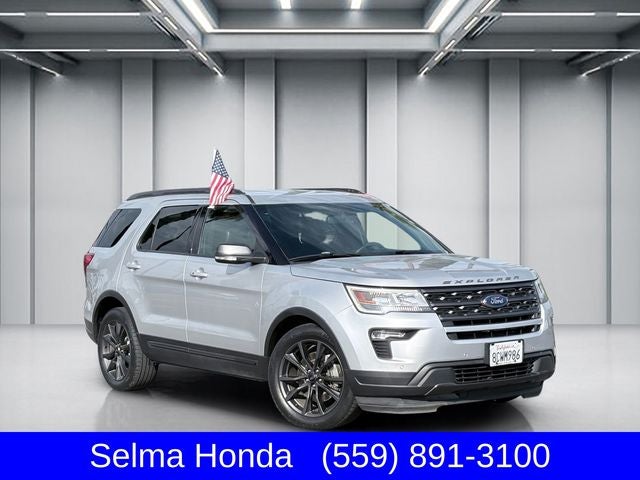 2018 Ford Explorer XLT in Ingot Silver — front three-quarter view
