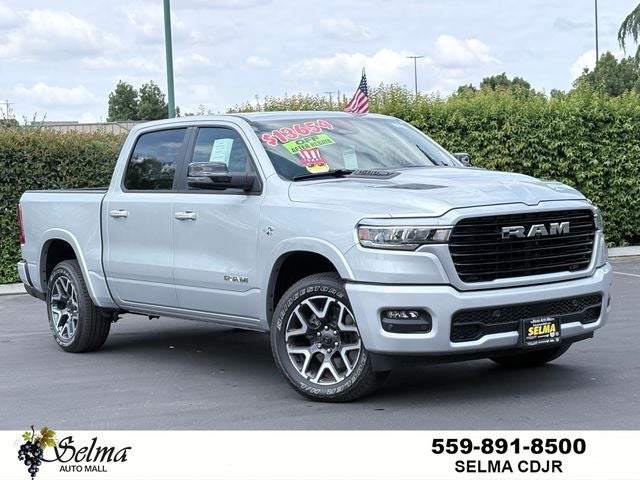 2026 RAM Ram 1500 RAM 1500 LARAMIE CREW CAB 4X4 5'7' BOX in Silver Zynith Exterior Paint — front three-quarter view