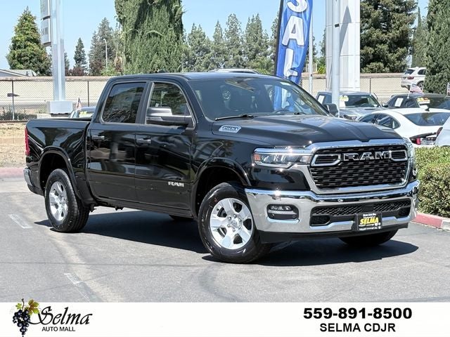 2026 RAM Ram 1500 RAM 1500 BIG HORN CREW CAB 4X4 5'7' BOX in Diamond Black Crystal Pearl-Coat Exterior Paint — front three-quarter view