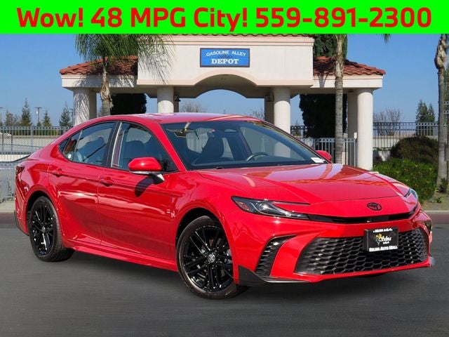2025 Toyota Camry SE in Supersonic Red — front three-quarter view