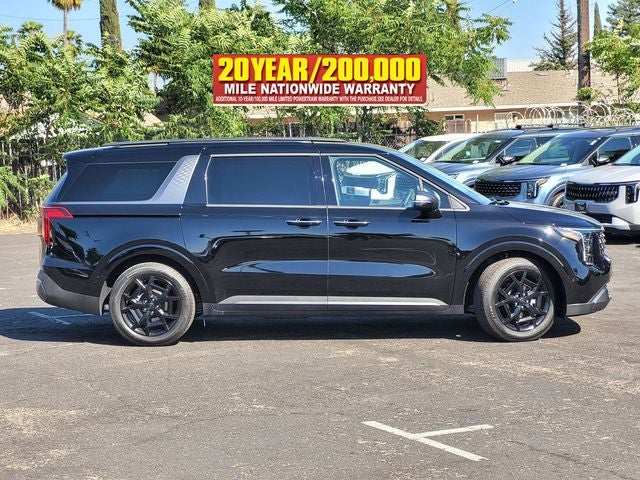 2026 Kia Carnival — rear three-quarter view
