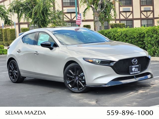 2026 Mazda Mazda3 Hatchback 2.5 Turbo Premium Plus AWD in Platinum Quartz Metallic — front three-quarter view