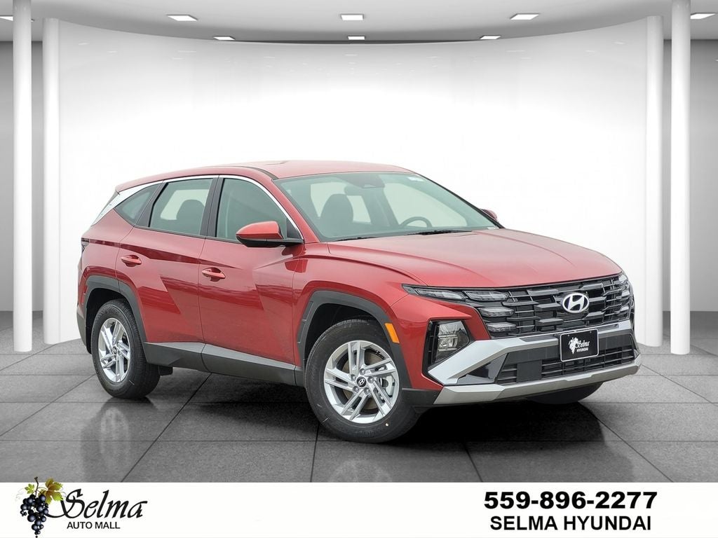 2026 Hyundai Tucson SE in Red — front three-quarter view