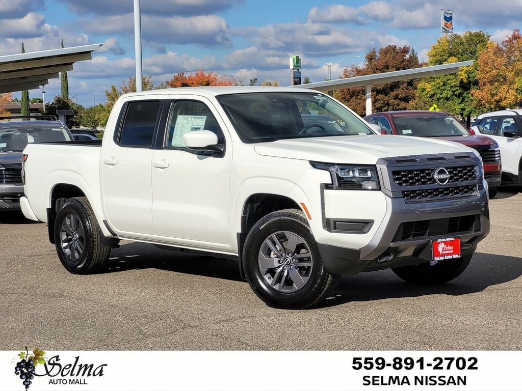 2026 Nissan Frontier Crew Cab SV in Glacier White — front three-quarter view